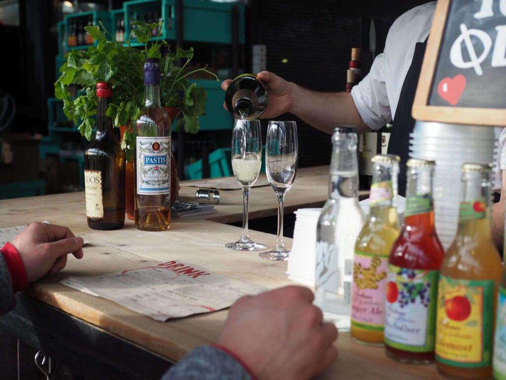 Glass of champagne at Le Petit Vinbar: Eating and Drinking at Torvehallerne in Copenhagen