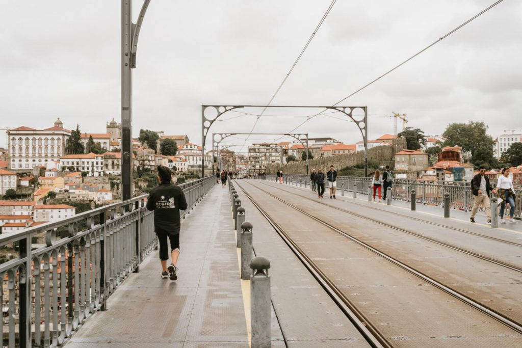 Walking across the bridge in Porto, Portugal